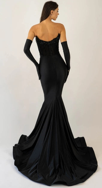 Jessica Angel 2560 Strapless Beaded Gown – A sleek black gown with a fitted silhouette, strapless beaded bodice, and floor-length skirt with a train, perfect for red carpet events.