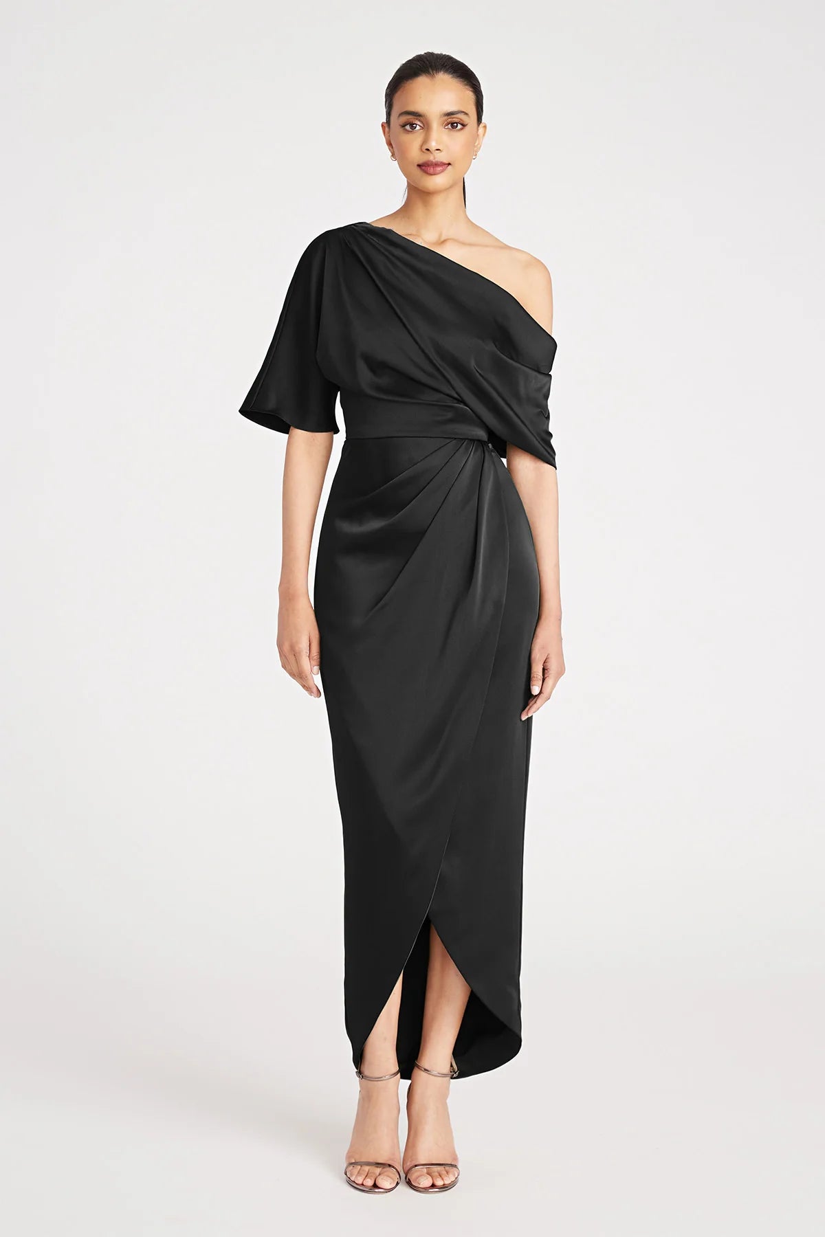 Theia 8818838 Asymmetric Tea-Length Dress in navy blue - Perfect for evening events, mothers of the bride or groom. Model is wearing the dress in Black.