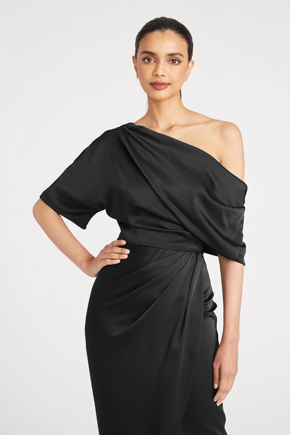 Theia 8818838 Asymmetric Tea-Length Dress in navy blue - Perfect for evening events, mothers of the bride or groom.  Model is wearing the dress in Black.