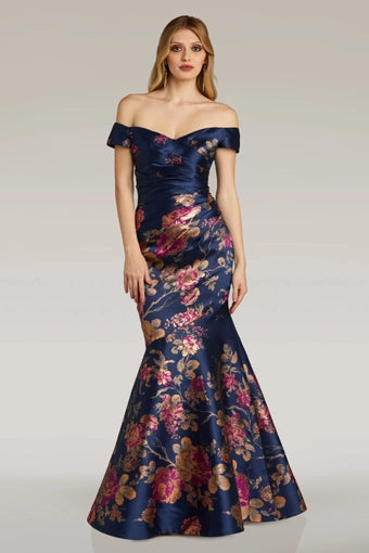 Elegant Feriani Couture evening gown, Style 18338, featuring an off-the-shoulder neckline and floral print on a navy base.