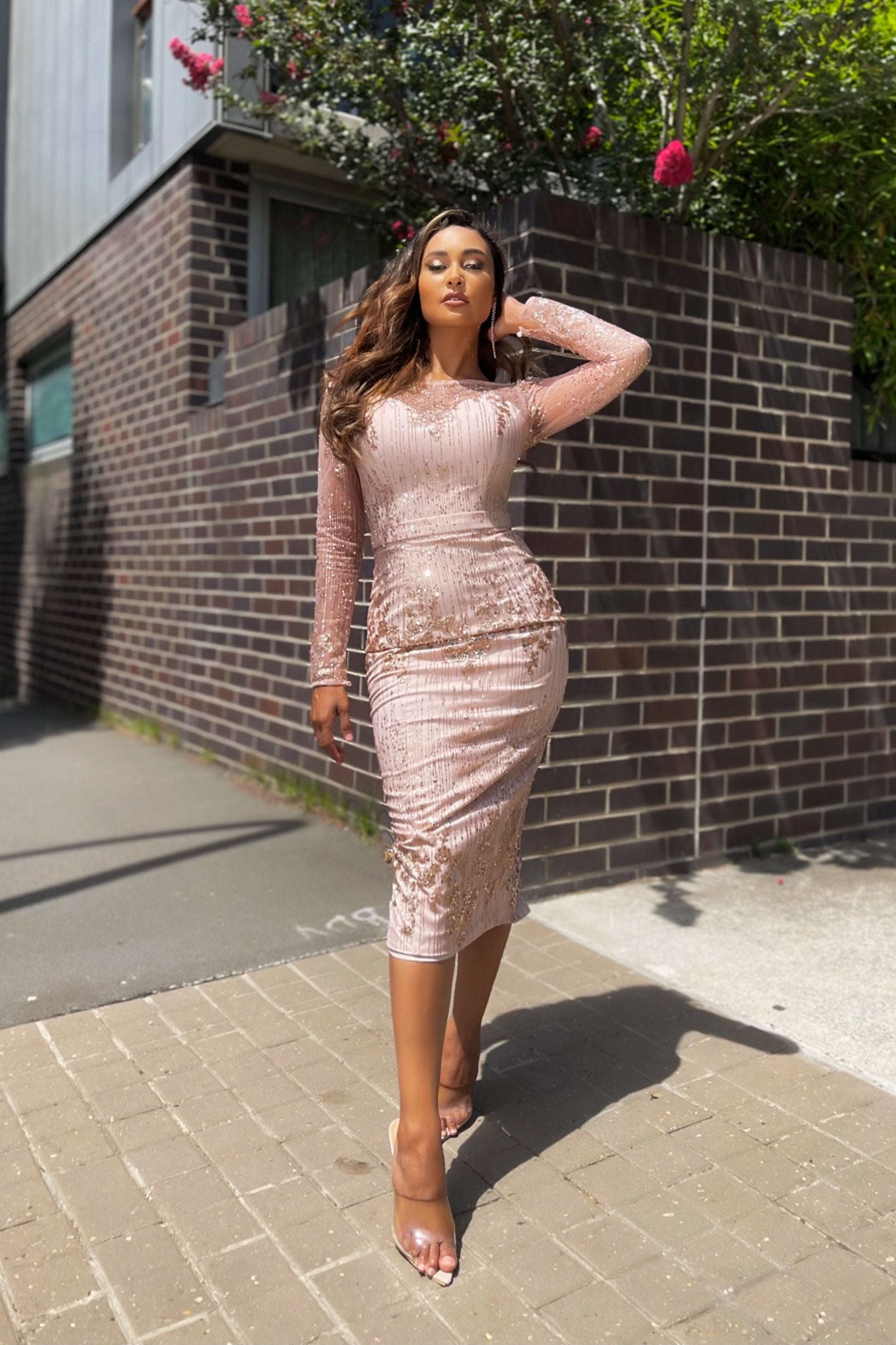 Jadore JX5047 Sequined Off-the-Shoulder Evening Cocktail Dress - A dazzling midi cocktail dress featuring long sheer sleeves, an off-the-shoulder neckline, and a fitted silhouette, embellished with sequins and glitter.