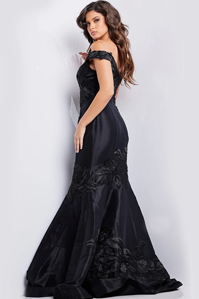 Jovani 23928 Black Floral Mermaid Evening Dress - An off-the-shoulder mermaid gown in classic black with intricate floral embroidery for a timeless and glamorous look at evening formal events.