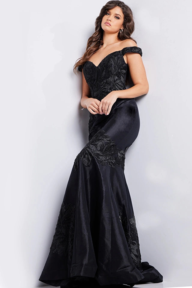 Jovani 23928 Black Floral Mermaid Evening Dress - An off-the-shoulder mermaid gown in classic black with intricate floral embroidery for a timeless and glamorous look at evening formal events.