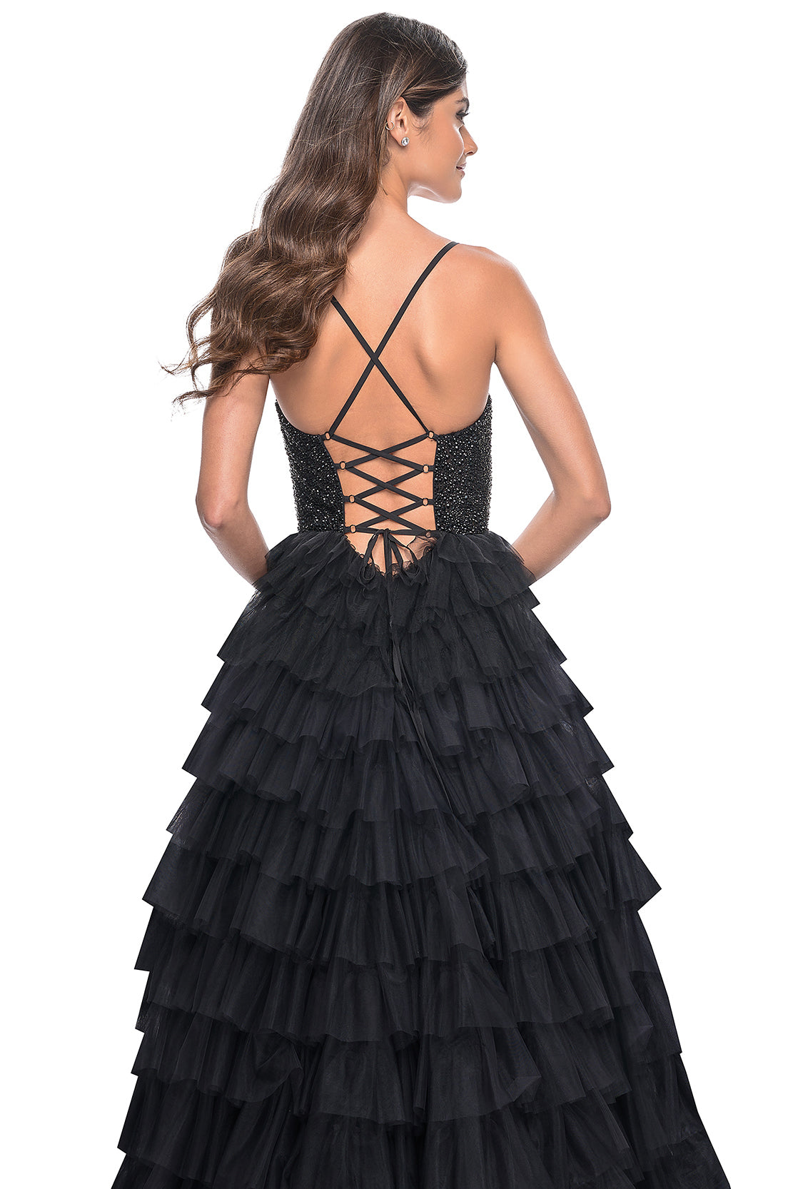 La Femme 32002 Glamorous Rhinestone Embellished Prom Dress - A stunning prom dress featuring a tiered ruffle skirt, fully rhinestone embellished bodice, high slit, and adjustable lace-up back for an elegant and customized look.