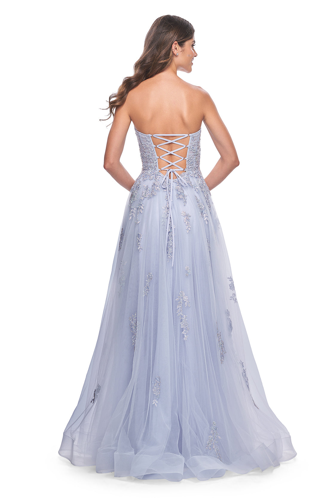 La Femme 32084 A-Line Prom and Quinceañera Gown with Lace Applique - An enchanting A-line gown featuring delicate ruched detail, a lace-up bodice, sweetheart neckline, and intricate lace applique for a statement look at prom or quinceañera celebrations. The dress in the picture is light periwinkle.