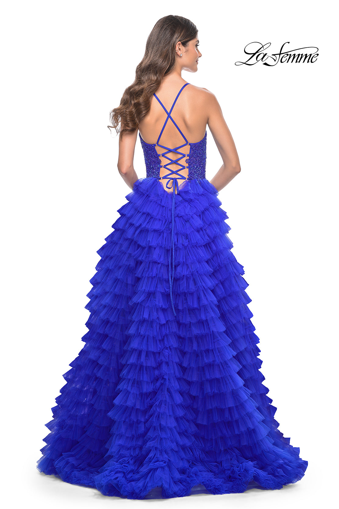 La Femme 32128 Dreamy Ruffle Tulle Tiered Prom Dress - A captivating prom dress featuring a dreamy ruffle tulle tiered skirt, high slit, and intricate lace applique details for an enchanting and sophisticated look.  The model is wearing royal blue.