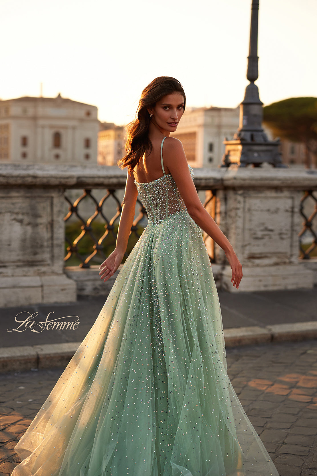 La Femme 32146 Radiant Rhinestone Illusion A-Line Prom Gown - An enchanting prom gown featuring radiant large rhinestones, an alluring illusion bustier bodice, and a V neckline for a dazzling and sophisticated look.  The model is wearing sage green.