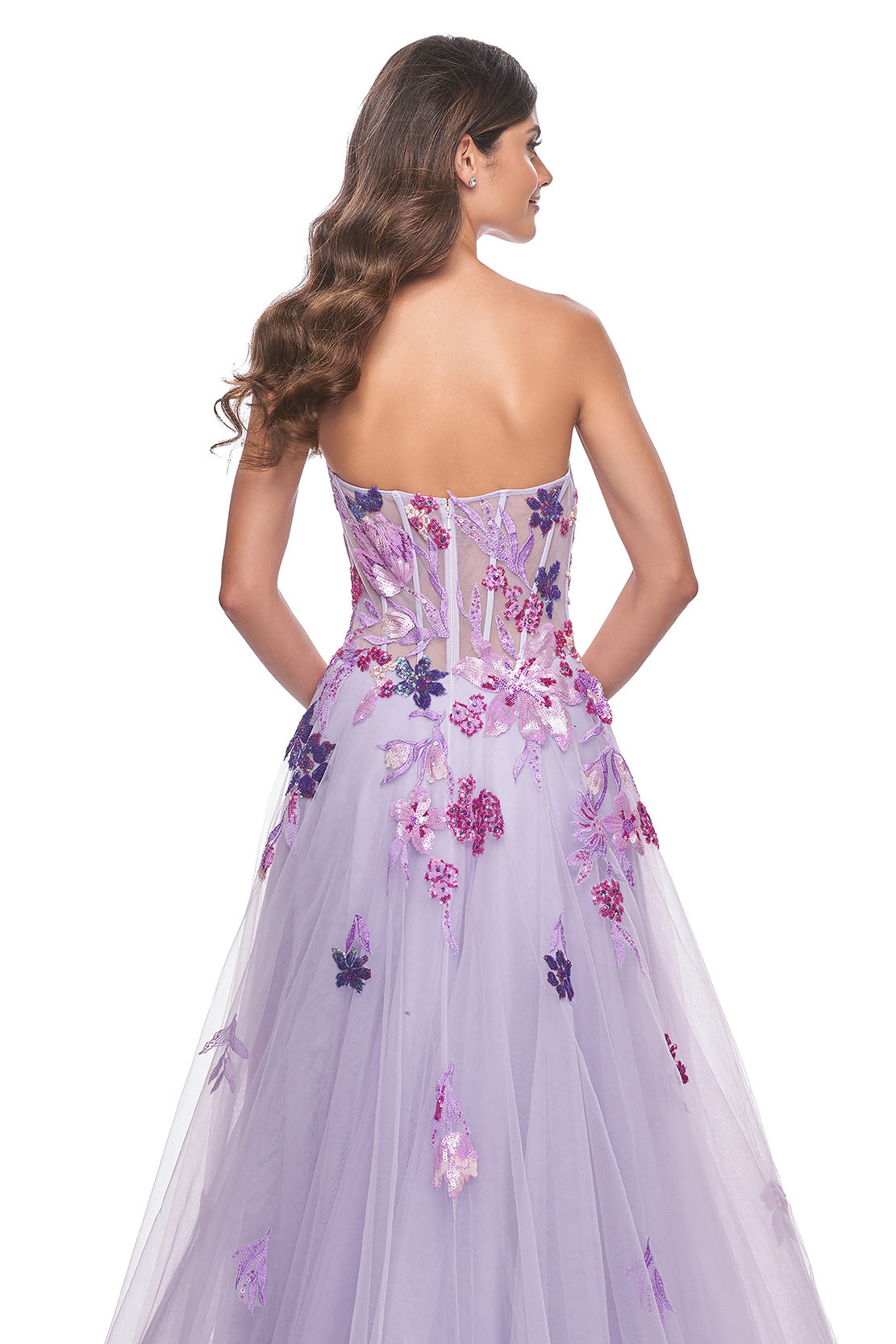 La Femme 32156 Strapless A-Line Tulle Prom and Quinceañera Dress - A captivating A-line tulle dress featuring a strapless design and floral multicolor sequin lace applique details, perfect for making a statement at prom or quinceañera celebrations. The model is wearing the dress in the color Lavender.