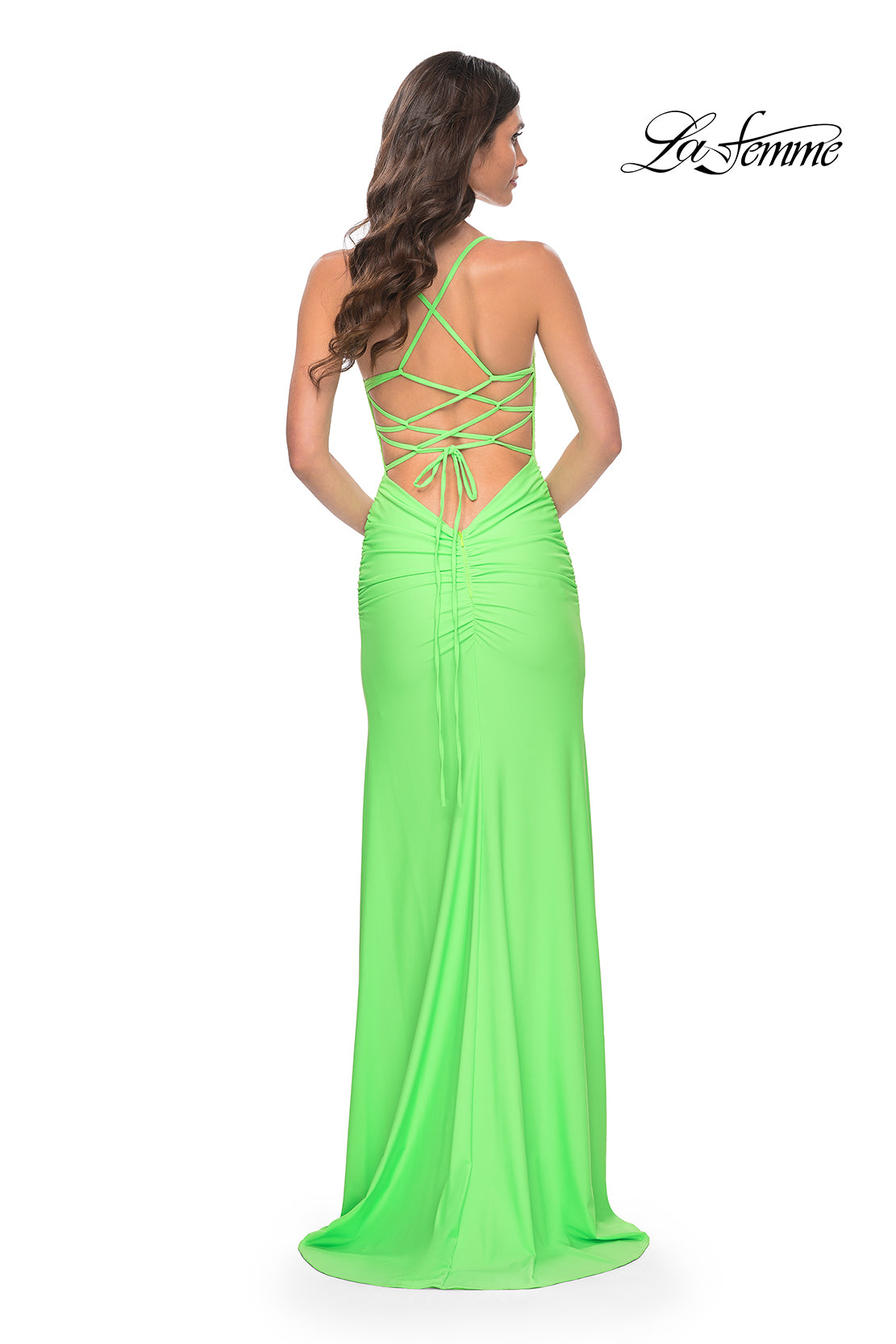La Femme 31988 Rhinestone Embellished Lace Bodice Prom Gown - A glamorous long dress featuring a ruched jersey skirt, high slit, rhinestone embellished lace bodice with exposed boning, lace-up back, and ruching along the zipper for a perfect fit.  The model is wearing the dress in bright green.