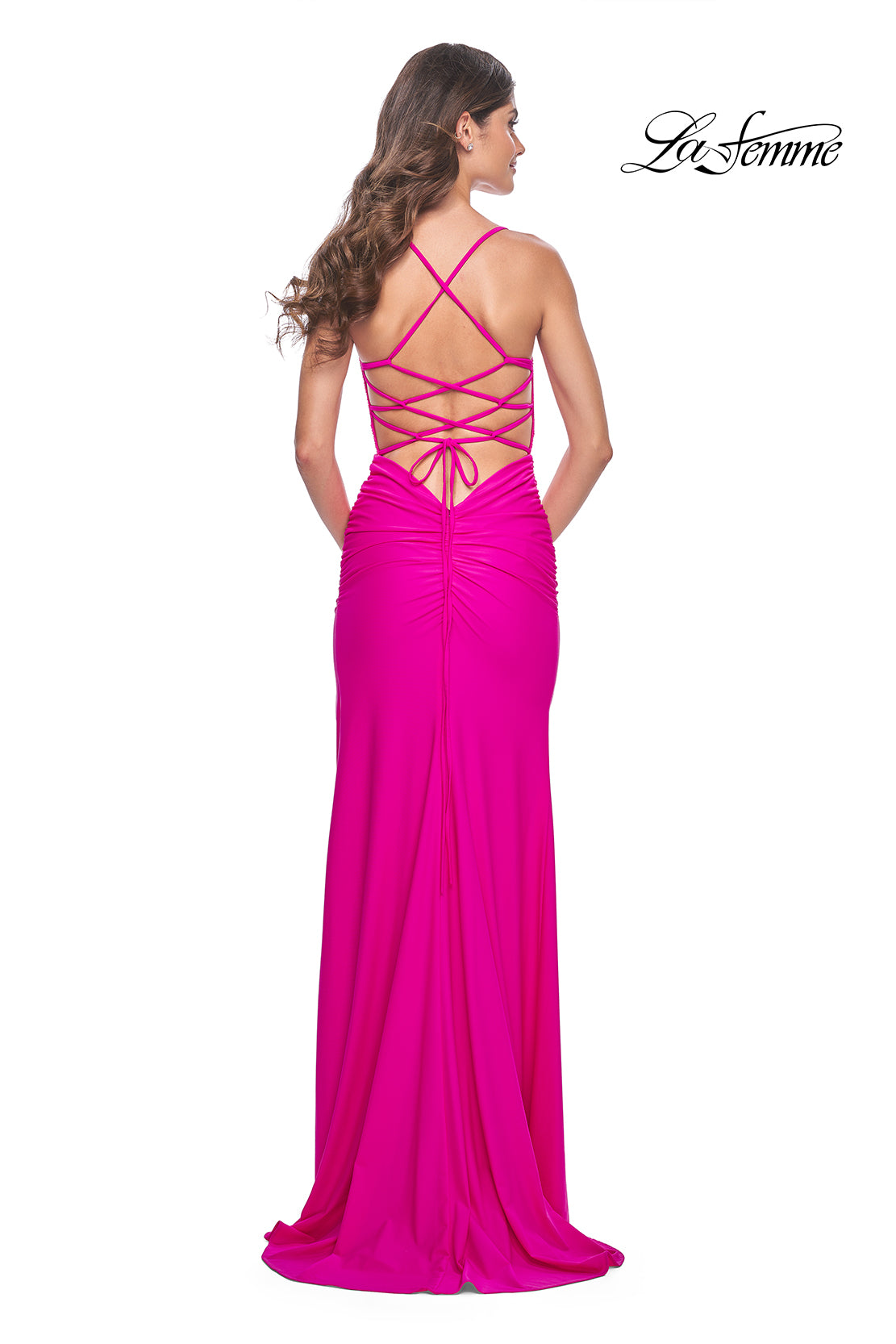 La Femme 31988 Rhinestone Embellished Lace Bodice Prom Gown - A glamorous long dress featuring a ruched jersey skirt, high slit, rhinestone embellished lace bodice with exposed boning, lace-up back, and ruching along the zipper for a perfect fit.  The model is wearing the dress in hot fuchsia.