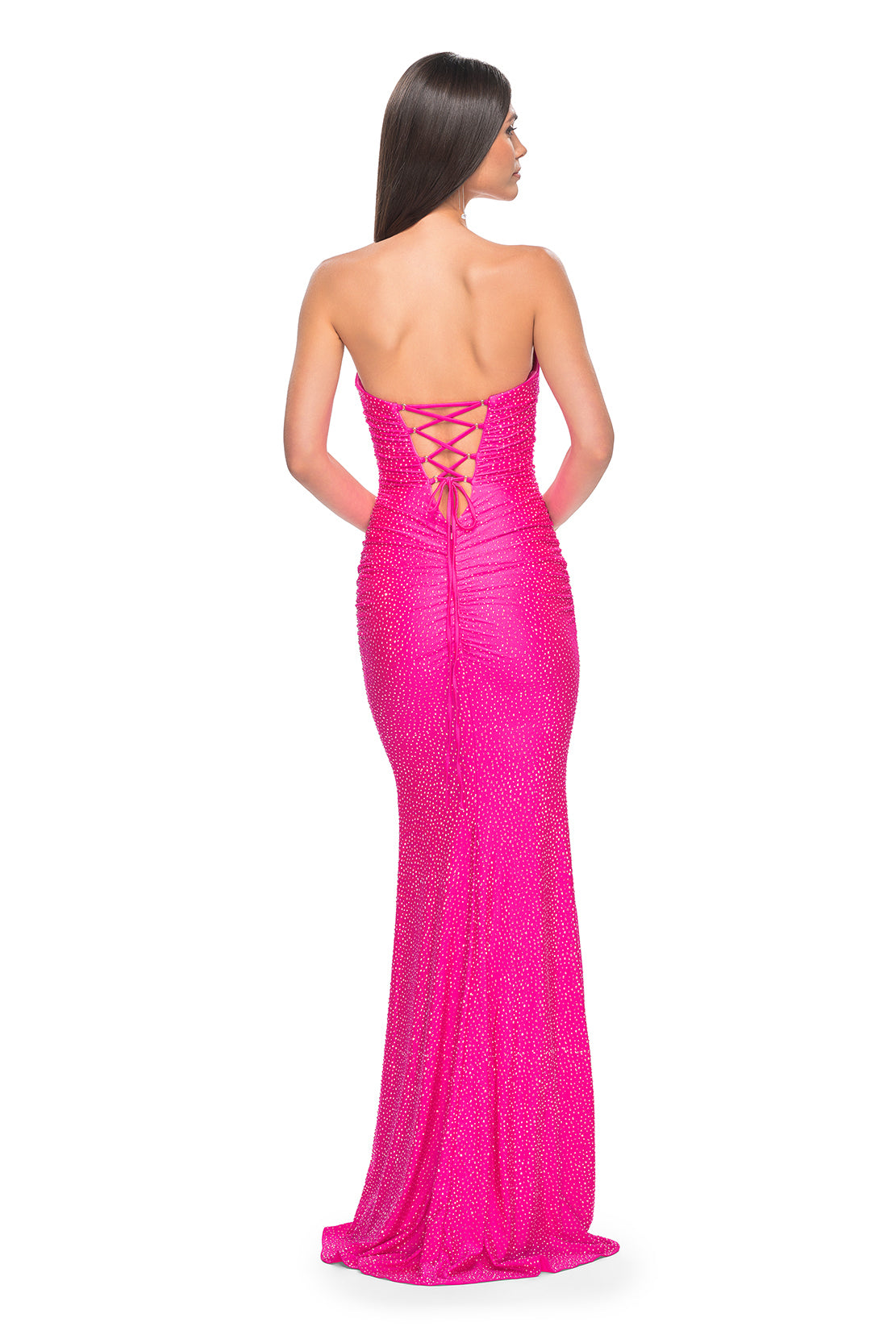 La Femme 32436 Strapless Rhinestone Embellished Prom Gown - A glamorous prom gown with a strapless design, tonal rhinestone embellishments, sweetheart neckline, and a lace-up back for added allure. Model is wearing neon pink.