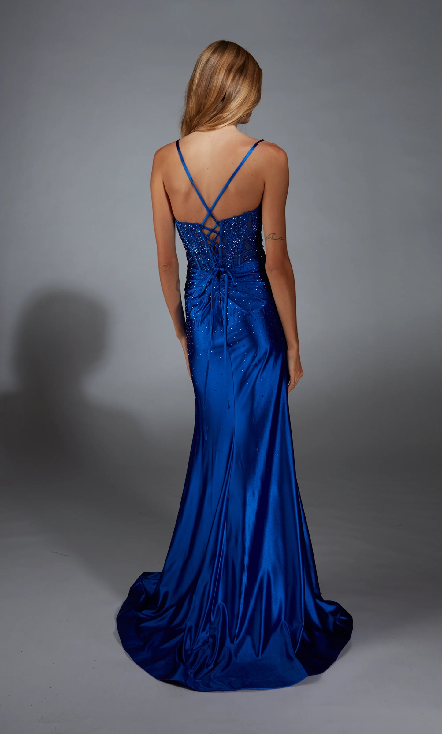 Paris Ayce 61827 Stretch Satin Corset Gown in royal blue featuring an embellished bodice, a thigh-high slit, and a lace-up back. Ideal for prom and evening events.