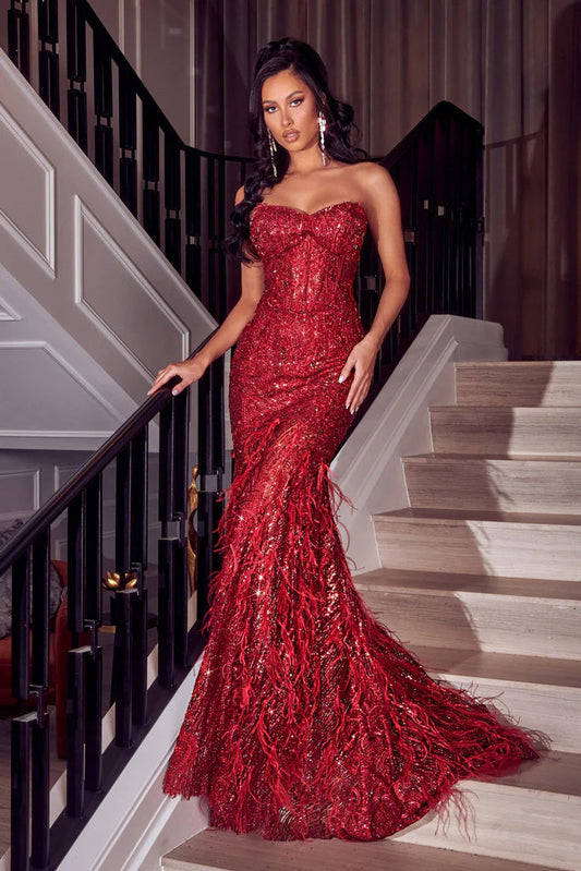 Portia&Scarlett PS23263 Elegant Strapless Gown - Luxurious gown featuring a strapless design, sequin detailing, fitted silhouette, and mermaid hemline with feather accents, perfect for formal evenings.