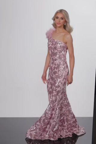 Jovani 25901 One Shoulder Sequin Mermaid Formal Evening Gown - A stunning one-shoulder gown with a sequin embellished pattern and feather detail for a show-stopping entrance at formal evening events. This is a video of the model wearing the dress.