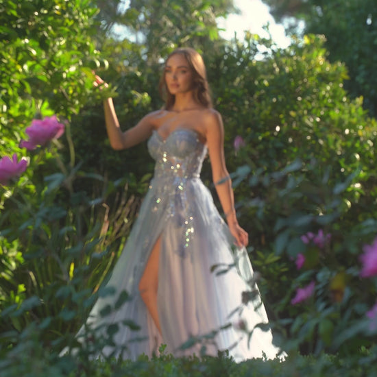 Andrea&Leo A1294 Floral Appliqué A-Line Prom Gown - A stunning A-line gown with a sheer boned bodice, delicate floral organza appliqué, layered tulle skirt, and a leg slit for a touch of allure, perfect for prom and special occasions.  This is a video.