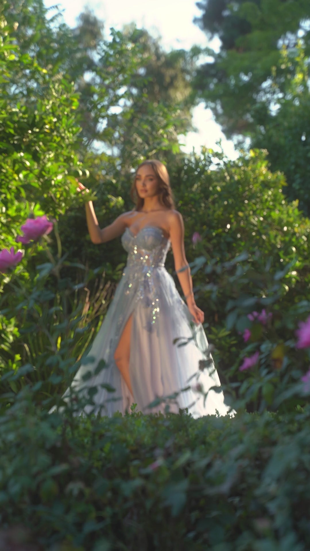 Andrea&Leo A1294 Floral Appliqué A-Line Prom Gown - A stunning A-line gown with a sheer boned bodice, delicate floral organza appliqué, layered tulle skirt, and a leg slit for a touch of allure, perfect for prom and special occasions.  This is a video.