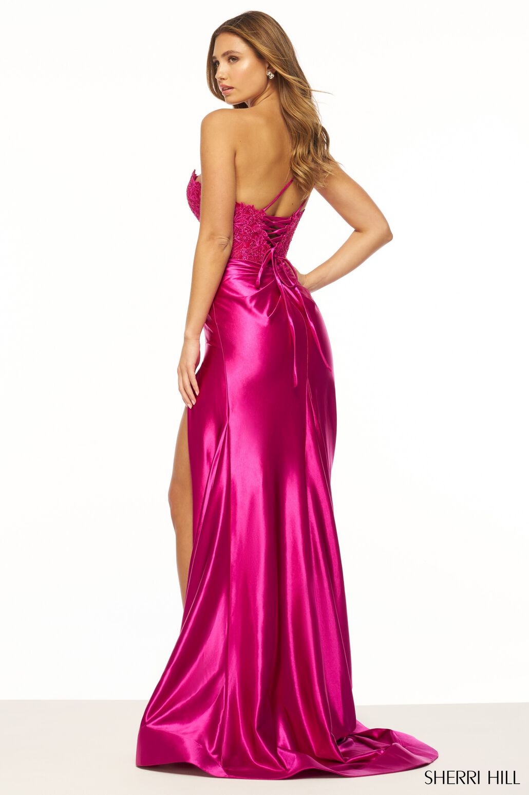 Sherri Hill 56174 One Shoulder Lace Prom/Evening Gown - A stunning gown featuring a one shoulder design, lace bodice with flower embellishments, sheer deep V neckline, and ruched stretched satin skirt with a slit for sophistication and glamour.