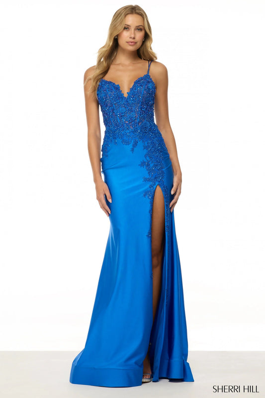 Sherri Hill 56448 Fitted Gown with Lace Corset Bodice and Skirt Slit – A sleek prom and evening dress featuring a lace corset, fitted silhouette, and bold slit.