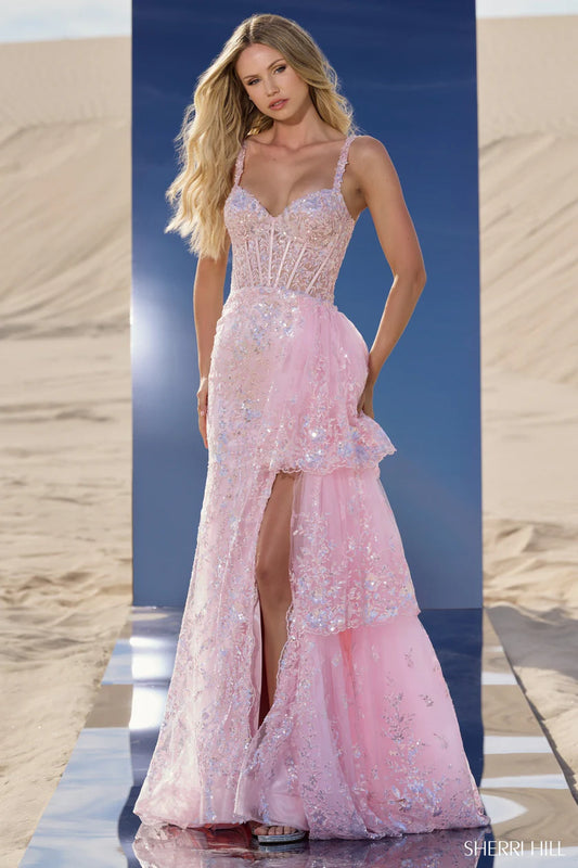 Sherri Hill 56589 sequin corset gown in pink with ruffle overskirt and high slit, perfect for prom and formal evenings.