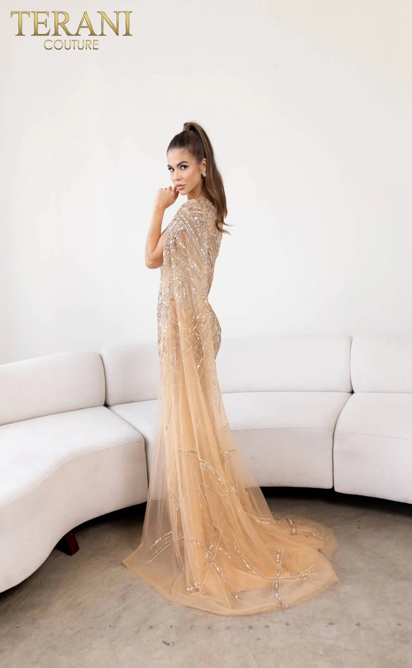 Terani 241GL2634 - An elegant one-shoulder crystal embellished evening formal dress, perfect for adding glamour to any special occasion. The model is wearing the color nude crystal..