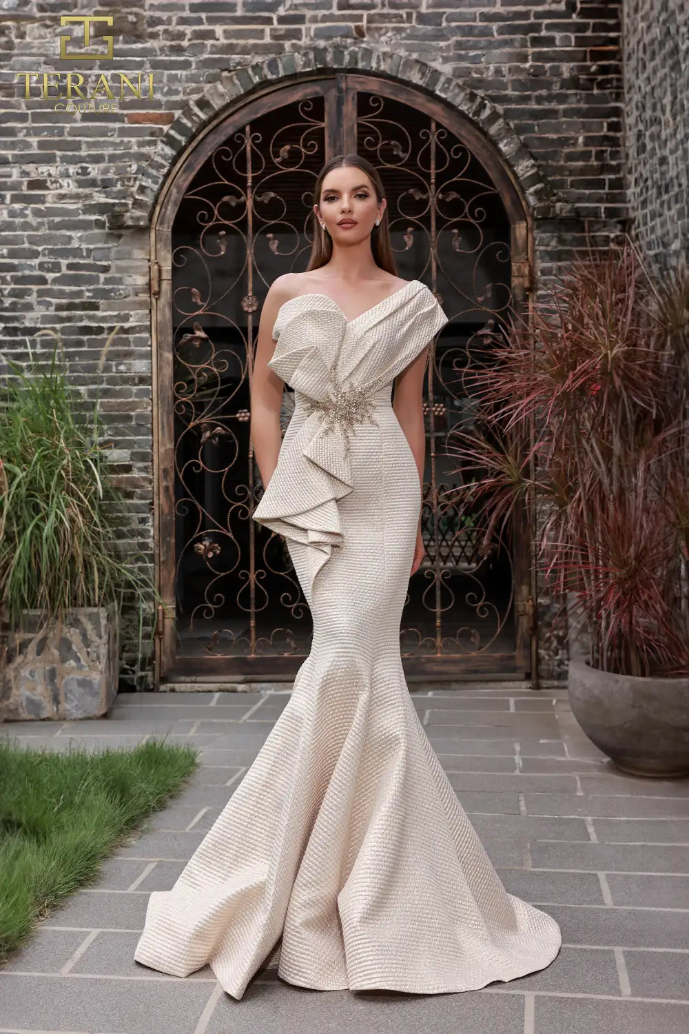 Terani Couture 251E4201 Jacquard Off-Shoulder Gown featuring asymmetrical draping, trumpet silhouette, and beaded waist detail.