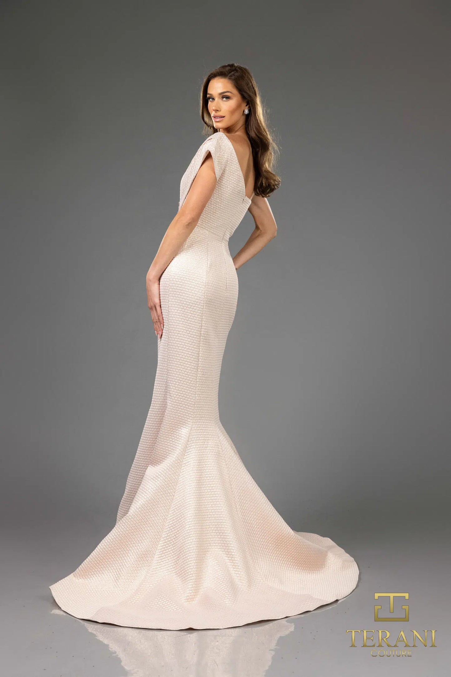 Terani Couture 251E4201 Jacquard Off-Shoulder Gown featuring asymmetrical draping, trumpet silhouette, and beaded waist detail.