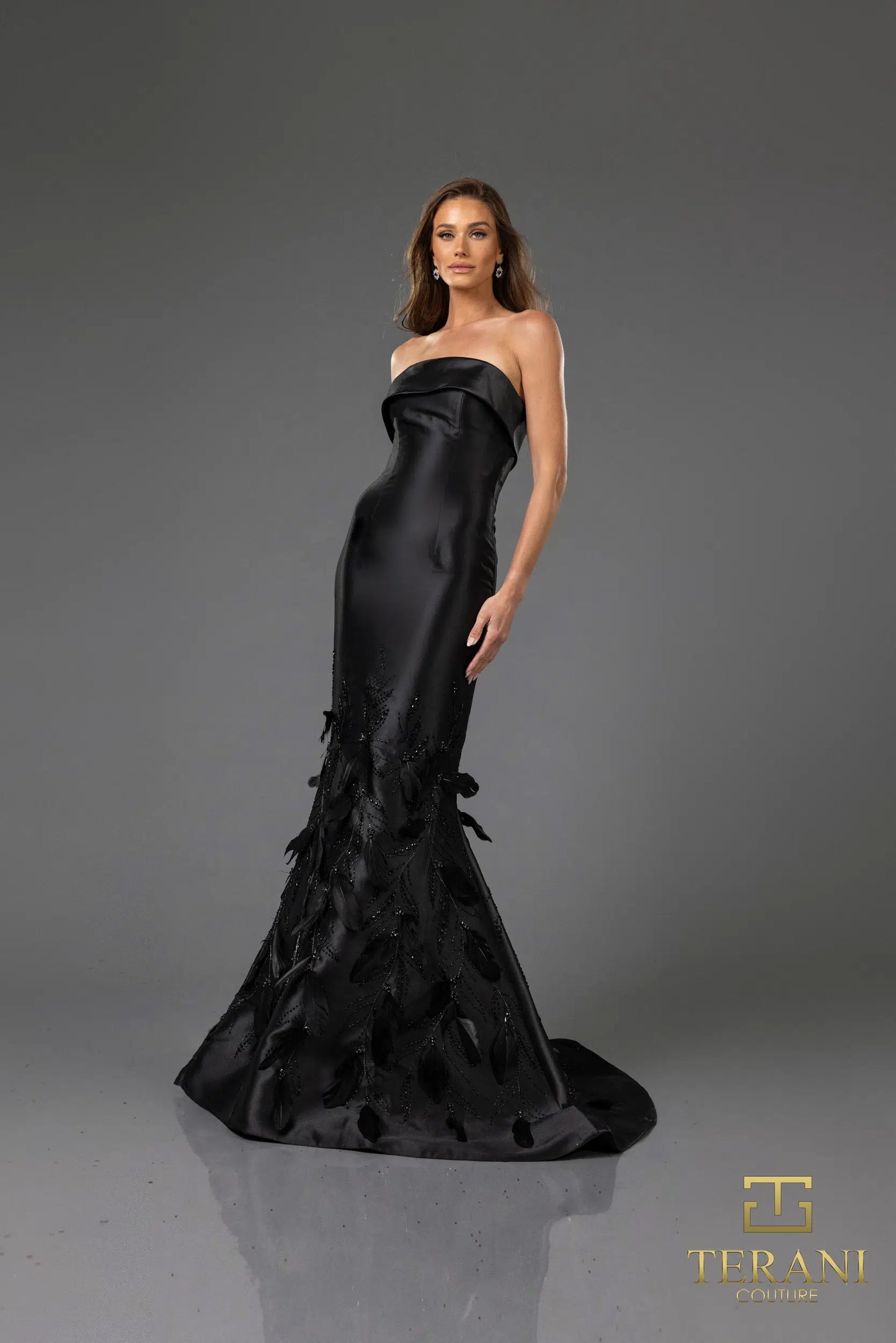 Terani Couture 251E4226 strapless gown in stretch Mikado, featuring feather and bead embellishments on the skirt. Perfect for evening events or as a mother of the bride gown.