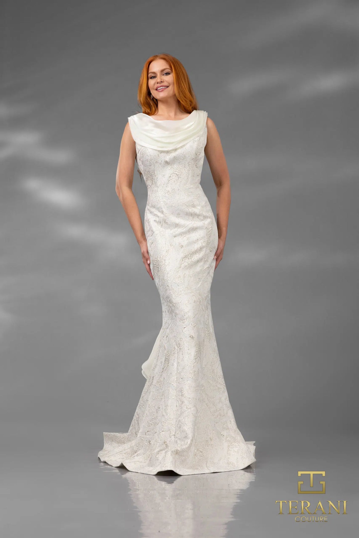 Terani Couture 251E4256 Draped Cowl-Neck Gown – A fitted evening gown featuring a soft draped cowl neckline, intricate lace detailing, and a cascading ruffle back for a sophisticated look.