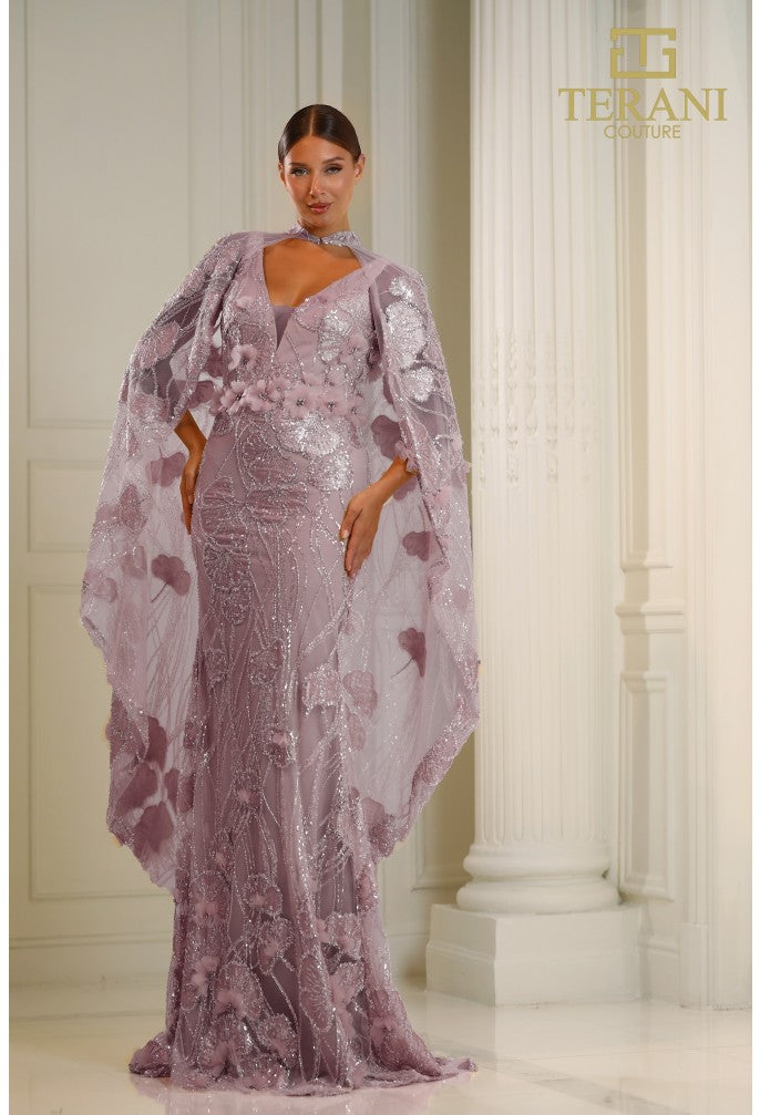 Terani Couture 251M4326 Lace Gown – A stunning fitted lace gown featuring an embellished sheer cape, intricate lace detailing, and a floor-length silhouette for a sophisticated look.