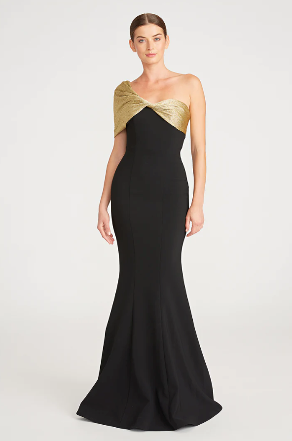 Theia 8818850 Asymmetric Neck Fit and Flare Gown, a floor-length dress with an asymmetric neckline and sleeve, draped bodice, ideal for special occasions and mothers of the bride or groom.