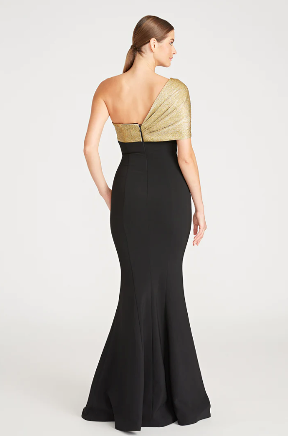 Theia 8818850 Asymmetric Neck Fit and Flare Gown, a floor-length dress with an asymmetric neckline and sleeve, draped bodice, ideal for special occasions and mothers of the bride or groom.